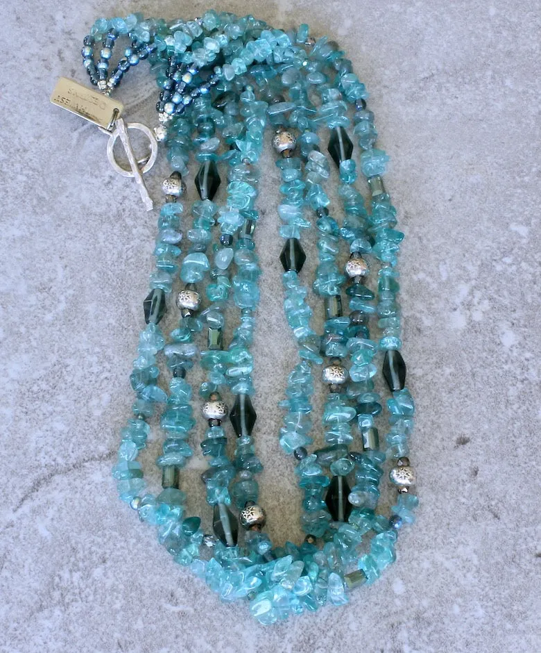 Blue Apatite Nugget 4-Strand Necklace with Montana Blue Czech Glass Rounds, Fire Polished Glass, Translucent Green Crystal Rectangles, Green Glass Faceted Cylinders, and Sterling Silver Rondelle Beads and Toggle Clasp