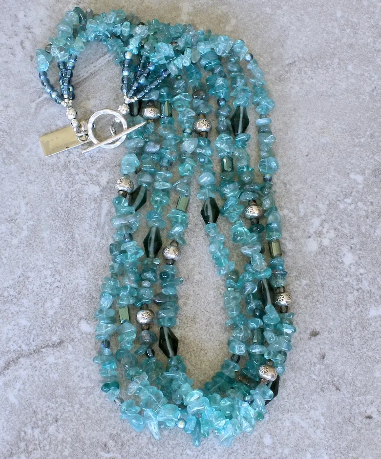 Blue Apatite Nugget 4-Strand Necklace with Montana Blue Czech Glass Rounds, Fire Polished Glass, Translucent Green Crystal Rectangles, Green Glass Faceted Cylinders, and Sterling Silver Rondelle Beads and Toggle Clasp