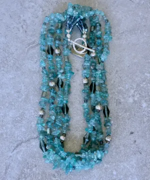 Blue Apatite Nugget 4-Strand Necklace with Montana Blue Czech Glass Rounds, Fire Polished Glass, Translucent Green Crystal Rectangles, Green Glass Faceted Cylinders, and Sterling Silver Rondelle Beads and Toggle Clasp