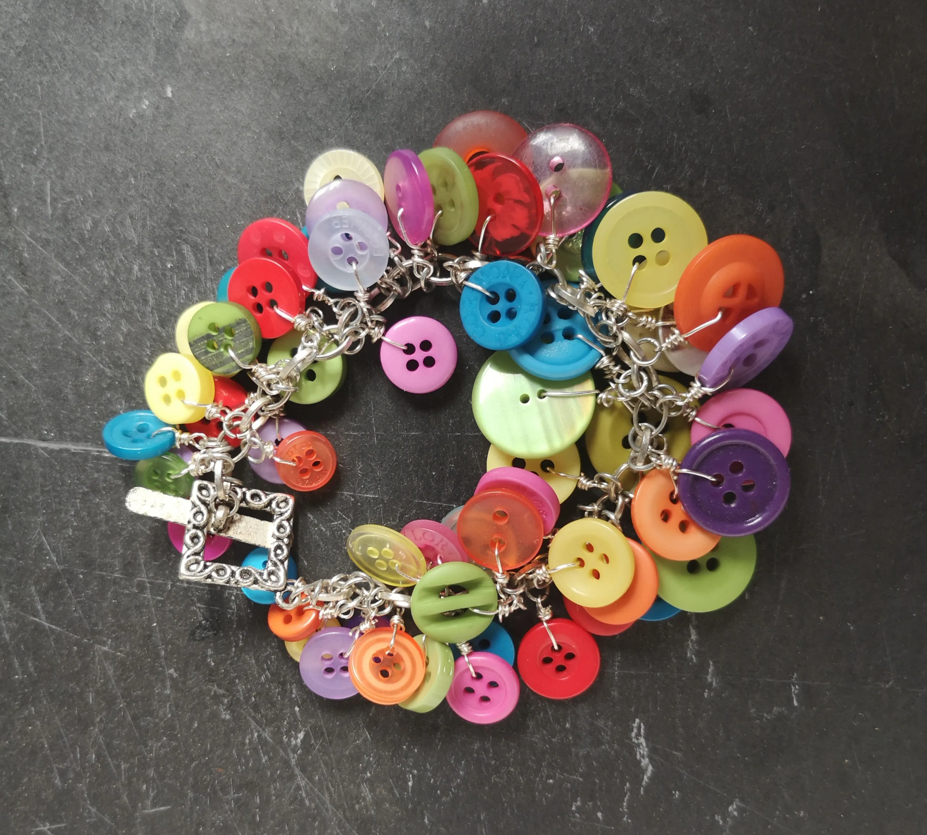 "Button me up" cute & fun cluster charm bracelet made with a rainbow of buttons,