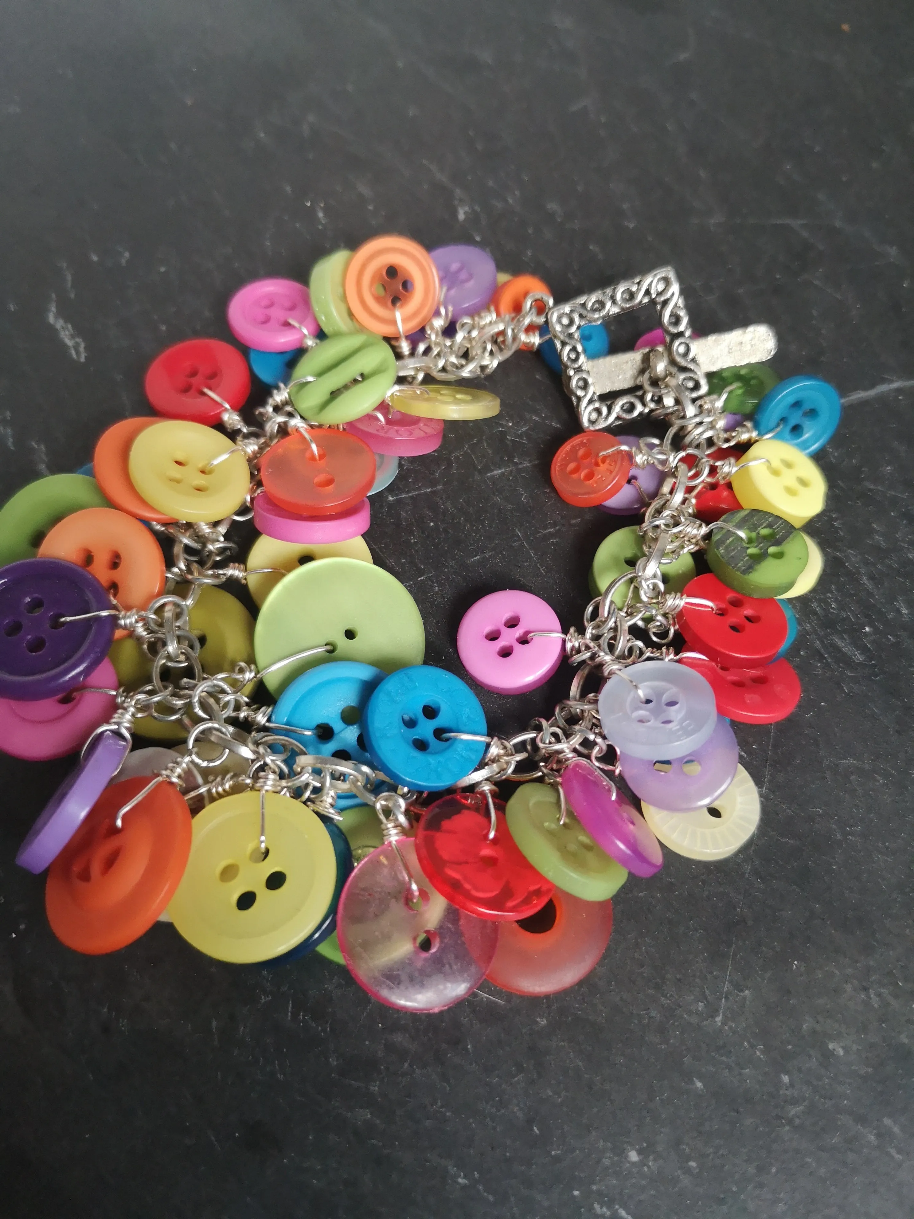 "Button me up" cute & fun cluster charm bracelet made with a rainbow of buttons,