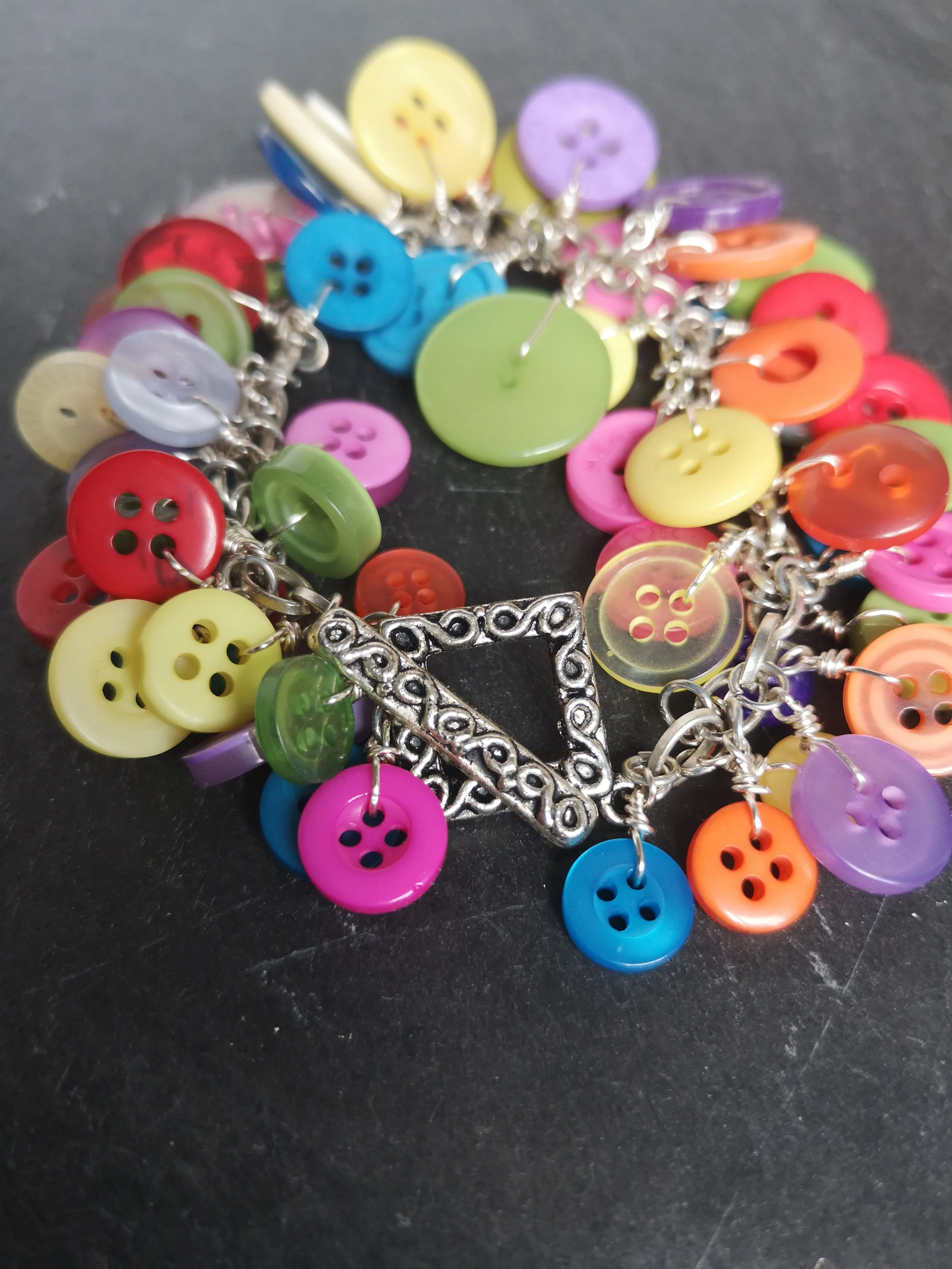 "Button me up" cute & fun cluster charm bracelet made with a rainbow of buttons,